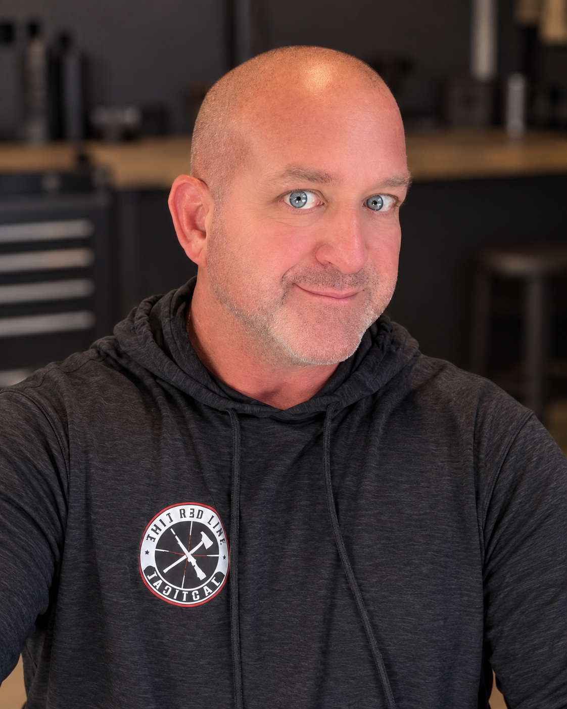 Founder of Thin Red Line Tactical wearing a TRLT hoodie