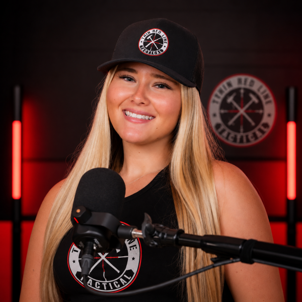 Woman wearing the TRLT Richardson 112 black trucker hat