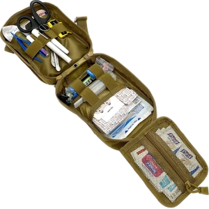 Open tan Wilderness First Aid Kit organizer with supplies secured inside